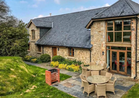 The patio, barbecue, alfresco dining area & enclosed garden at Rock Barn, South Tawton