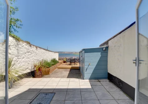 Step out into the courtyard garden & alfresco dining area at Rock Rose Cottage, Appledore