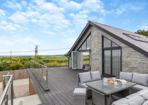 The decked balcony, barbecue & alfresco dining area at Rock View, Little Petherick