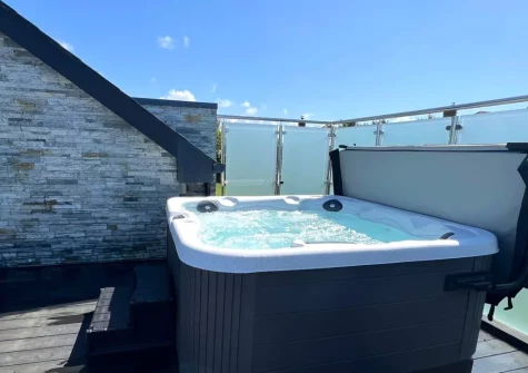 The decked balcony with hot tub at Rock View, Little Petherick