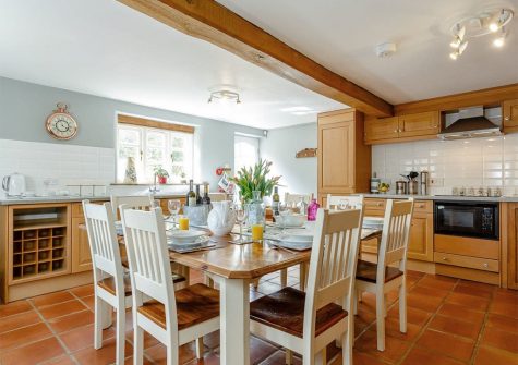 The farmhouse style kitchen & dining area at Rocombe Thatch, Higher Gabwell