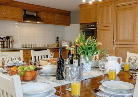 The farmhouse style kitchen & dining area at Rocombe Thatch, Higher Gabwell