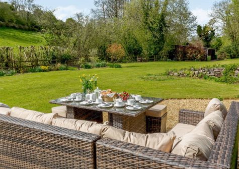 The sitting out area & garden at Rocombe Thatch, Higher Gabwell