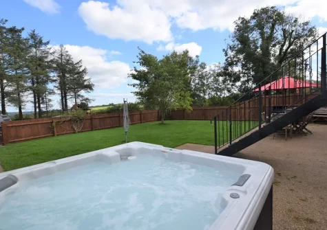 The hot tub, patio & garden at Rooks Nest, Hilltown Farm, Mariansleigh