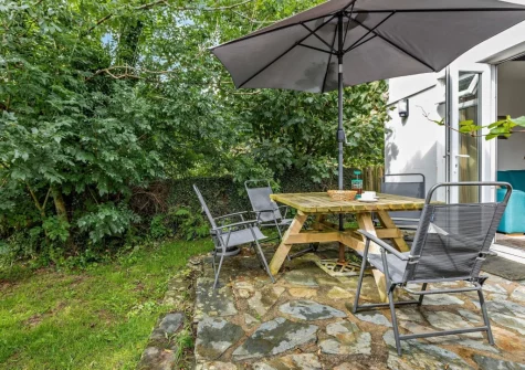 The patio, barbecue, alfresco dining area & garden at Rose Cottage at Fairview, West Down