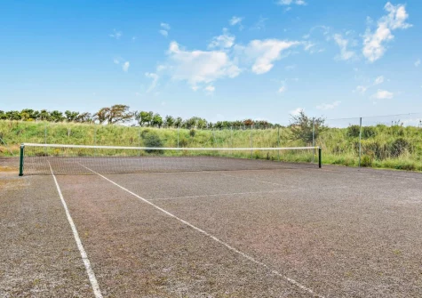The shared tennis court at Rose Cottage at Fairview, West Down