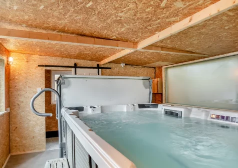 The pool house, with a full-size swim spa & shower room, at Rose Retreat, Perranporth