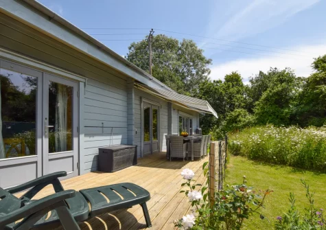 The decked terrace, outdoor sitting area & enclosed garden at Rose Retreat, Perranporth