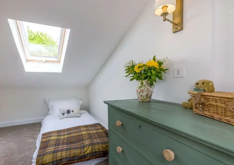 The mezzanine bedroom at Rose Week Cottage, Langtree