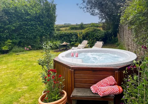 The hot tub & garden at Rose Week Cottage, Langtree