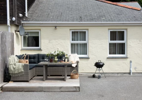 The decked patio, barbecue & alfresco dining area at Rosebud, Portreath