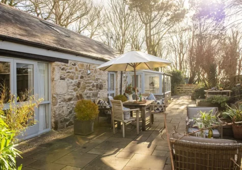 The wraparound terrace & alfresco dining area at Rosehendra, Rosevidney