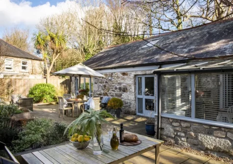 The wraparound terrace & barbecue area at Rosehendra, Rosevidney