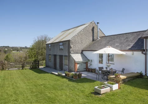 The patio, barbecue, alfresco dining area & enclosed garden at Roseland Cottage, Perranwell Station
