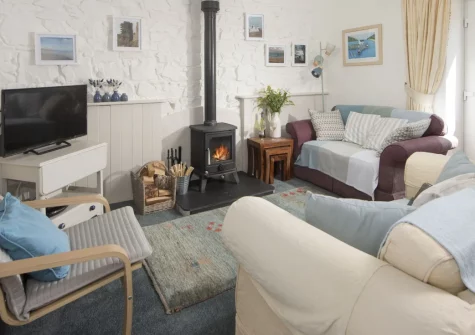 Roseland Cottage, Perranwell Station is a charming two-bedroom barn conversion with a cosy wood-burning stove, private enclosed garden and driveway parking, ideally placed for exploring Truro, Falmouth and Cornwall's dramatic coastlines and gardens.