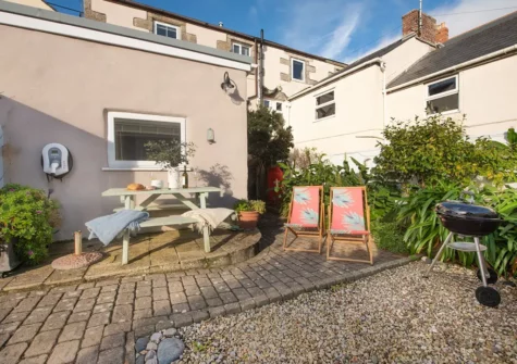 The courtyard garden, barbecue & alfresco dining area at Rosevean, Marazion