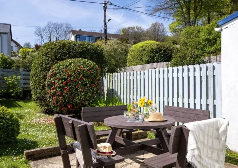 The patio, alfresco dining area & sunny south-facing garden at Rosie's Cottage, Mousehole
