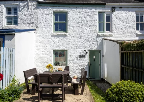 The patio, alfresco dining area & sunny south-facing garden at Rosie's Cottage, Mousehole