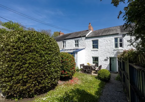 The patio, alfresco dining area & sunny south-facing garden at Rosie's Cottage, Mousehole