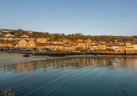 Mousehole is considered one of Cornwall's prettiest fishing villages, with two small sandy beaches inside its harbour quays, only accessible at low tide