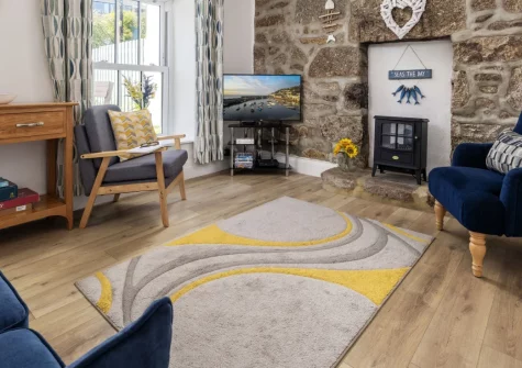 Rosie's Cottage, Mousehole is a charming granite cottage moments from a much-loved Cornish harbour. Enjoy a sunny south-facing garden, cosy log burner, and easy strolls to harbourside caf&eacute;s; a perfect coastal retreat for families and couples.