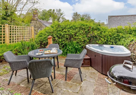 The patio, barbecue, alfresco dining area & hot tub at Rowan at South Torfrey Farm, Golant
