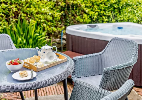 The patio, barbecue, alfresco dining area & hot tub at Rowan at South Torfrey Farm, Golant