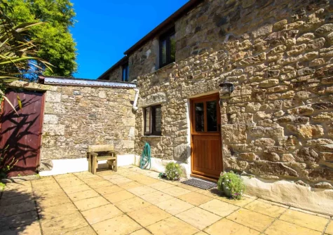 The wonderfully sunny patio at Ruby Farm Cottage, Porkellis