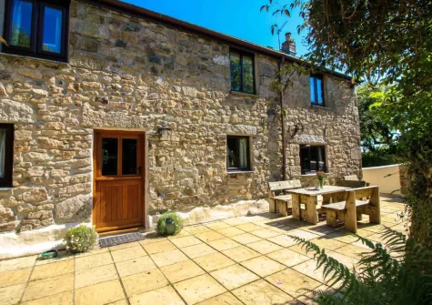 The patio, barbecue & alfresco dining area at Ruby Farm Cottage, Porkellis