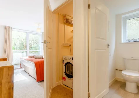 Bedroom #2, utility cupboard & en-suite shower room at Safe Harbour, Mevagissey