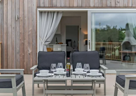 The decked patio & outdoor sitting area at Salcombe Lodge, Marldon