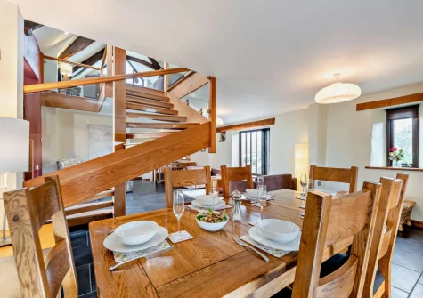 The barn dining area at Salterns River, Weare Giffard