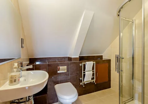 The farmhouse shower room at Salterns River, Weare Giffard