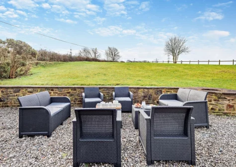 The outdoor sitting area at Salterns River, Weare Giffard