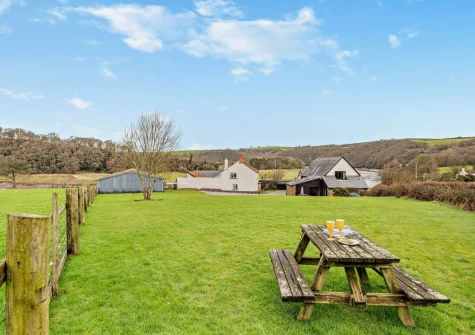 The garden & alfresco dining area at Salterns River, Weare Giffard