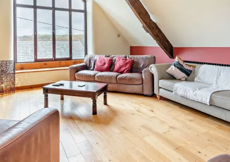 Salterns River, Weare Giffard is a stunning seven-bedroom riverside escape combining a traditional farmhouse and converted barn. Enjoy hot tub luxury, games barn fun, and easy access to North Devon's beautiful beaches and coastal attractions.