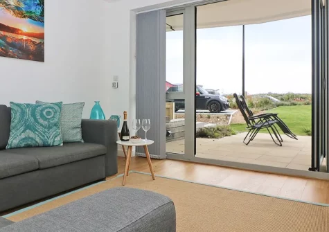 Saltwater, Newquay is a modern three bedroom two bathroom apartment overlooking Lusty Glaze Beach. Bi-fold doors open onto a terrace with interrupted sea views from this ground floor residence. Modern furnishings, well-equipped kitchen & parking.