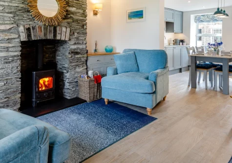 Samphire Cottage, Whitecross is a 200-year-old stone retreat on the edge of Wadebridge, featuring a wood burner, contemporary interiors, and courtyard garden, with the Camel Trail 800 metres away and North Cornwall's beaches within easy reach.