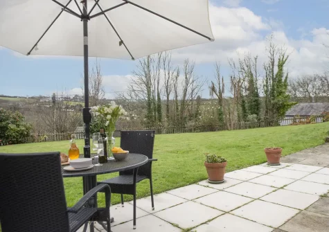 The patio, alfresco dining area & garden at Samson Cottage, St Mawgan