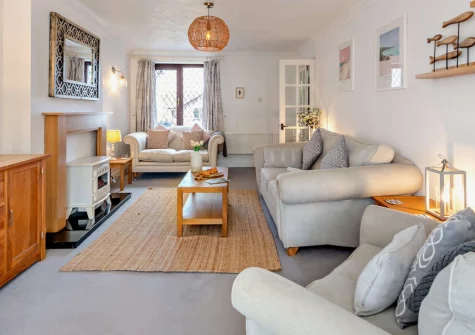 Sandals, Padstow is a spacious four-bedroom family home perfectly positioned near this foodie haven's harbour, featuring a sunny enclosed patio with barbecue, table tennis in the garage, and a warm welcome for your four-legged friends.