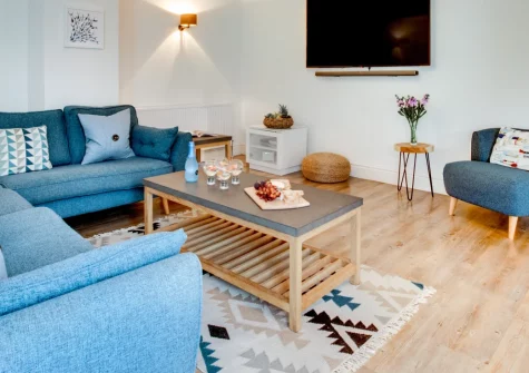 Sandpiper, Padstow is a chic three-bedroom apartment in the heart of this vibrant harbourside town, featuring a peaceful courtyard garden, rare private parking, and seamless access to acclaimed restaurants, independent shops and coastal walks.