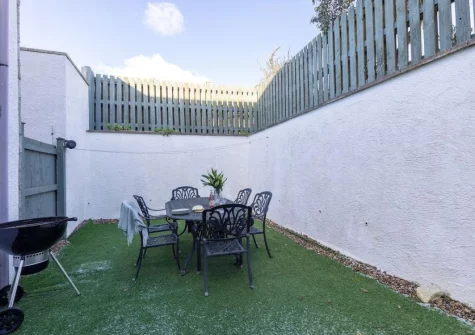 The sun trap garden, barbecue & alfresco dining area at Sandseekers Barn, Mawgan Porth