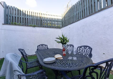The sun trap garden & alfresco dining area at Sandseekers Barn, Mawgan Porth