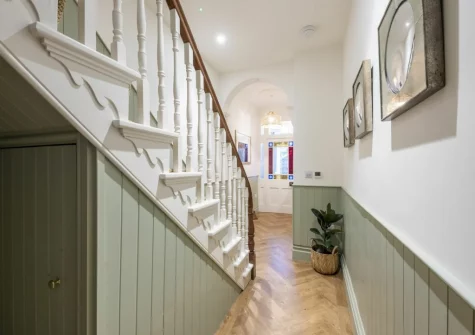 The entrance hallway & stairs up to the first floor at Sandy Boobies, St Ives
