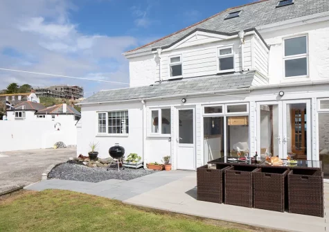 The patio, barbecue, alfresco dining area & garden at Sandy Cove, Portmellon