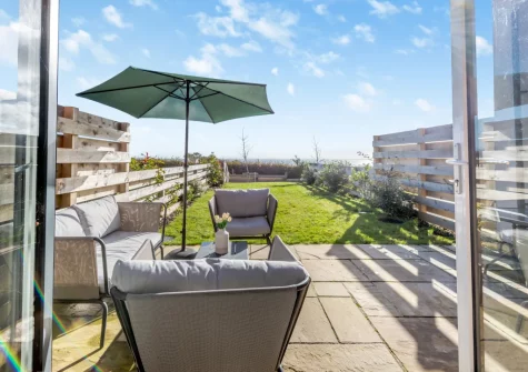 The patio, outdoor sitting area & garden at Sandy Toes, Stoke Fleming