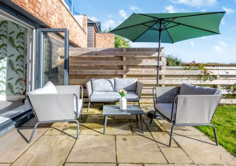 The patio, outdoor sitting area & garden at Sandy Toes, Stoke Fleming