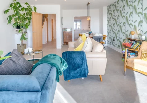 Sandy Toes, Stoke Fleming is a stunning three-storey house set within the South Devon AONB, featuring spectacular sea views from multiple levels, contemporary interiors with luxurious touches, and direct access to the coastal path and the beach.