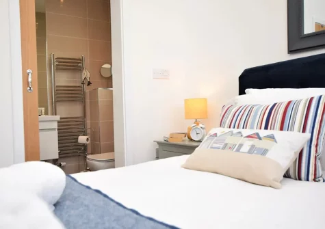 Bedroom #1 & en-suite shower room at Sandy Toes, Westward Ho!