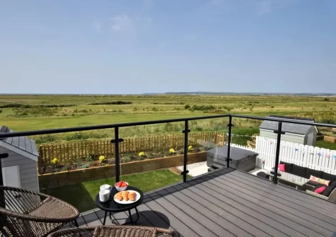 The balcony & outdoor sitting area at Sandy Toes, Westward Ho!